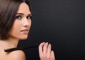 Fototapeta premium Portrait of young beautiful girl with combo