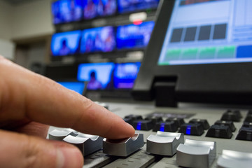 hand on a light, mixing desk fader in blur television gallery