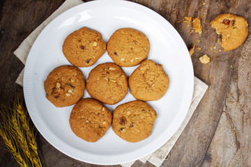 Oatmeal raisin cookie isolated on a wooden background
