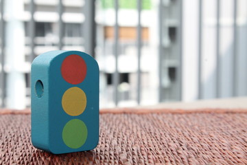 Fototapeta premium Traditional thai style nature background of brown handicraft weave texture wicker surface for furniture material with blue toy traffic light on it