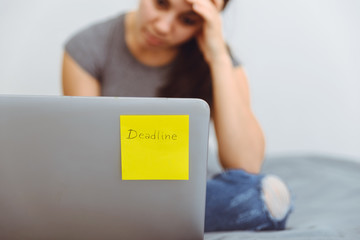 worried woman working on laptop