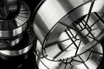 welding wire, stainless steel, on a black background