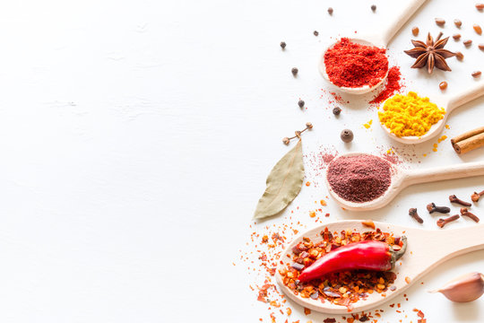 seasonings and spices on a white background with space for text