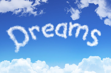 Word dreams from the clouds against the blue sky.
