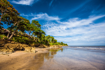 Tropical sandy Beach Jimbaran in Indonesia Bali. Vacation Travel Tourism Relax.