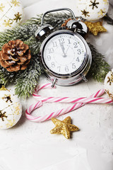 Christmas card with clock and winter decoration