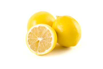 Lemons with leaves on a white background. Fresh lemons on a white background.