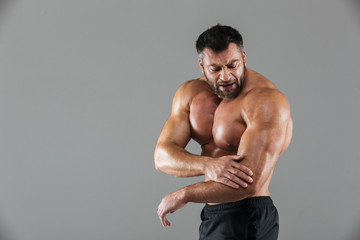 Fototapeta na wymiar Portrait of a muscular male bodybuilder