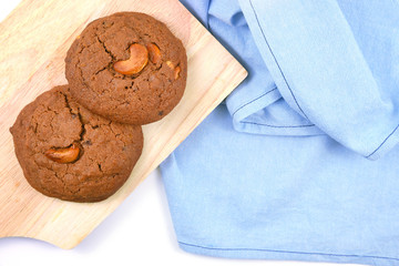 Cookie isolated on blue cloth and white background.
