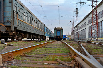 Obraz premium Passenger and freight train. Passenger diesel train traveling speed railway wagons journey light