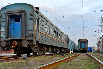 Obraz premium Passenger and freight train. Passenger diesel train traveling speed railway wagons journey light