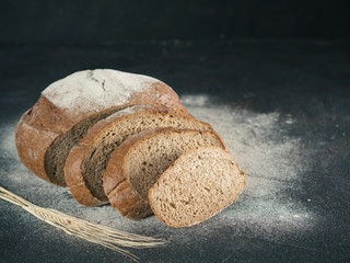 Sliced homemade sourdough rye bread, copy space