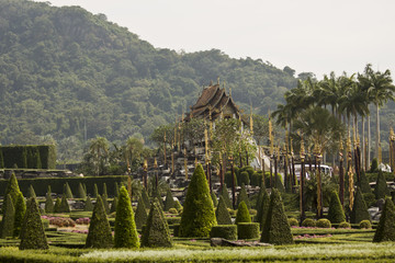 Fototapeta na wymiar Beautiful Buddhist Pagoda in the tropical garden of Thai Pattaya.