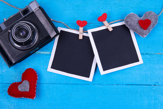 vintage camera on a turquoise wooden background valentine's day