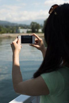 Woman Taking A Photography With Her Mobile Phone