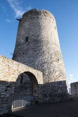 Fototapeta na wymiar Round stone tower of the medieval castle
