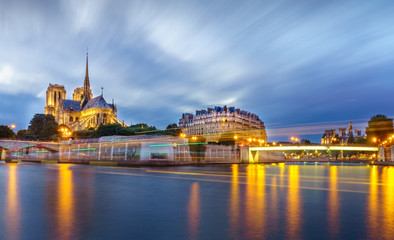 Long exposure river and cathedral of Saint Michel Notre Dame, Paris, France, Europe. Beautiful water and light color. best-known church buildings in the Catholic Church in the world. best for tourist.