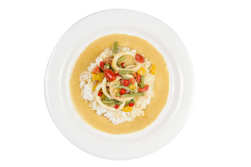 Squid rings in chilli curry sauce with green beans, tomatoes, peppers. Served with rice. Thai food.