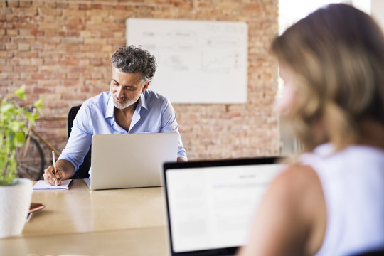 Businessman working at desk in office