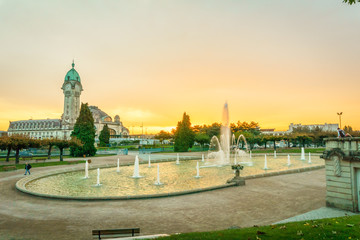 Limoges-Bénédictins sunset view with water pool fountain, railway station, in the Orléans–Montauban railway. Named due to the presence of a Benedictine monastery closed during the France revolution