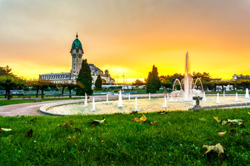 Limoges-Bénédictins sunset view with water pool fountain, railway station, in the...