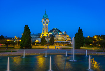 Naklejka premium Limoges-Bénédictins night view with water pool fountain, main railway station of Limoges, in Orléans–Montauban. Named due to the presence of a Benedictine monastery closed during the France revolution