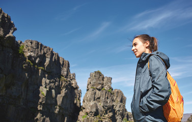 Fototapeta premium young woman hiker hiking in beautiful mountains