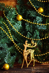 Christmas still life with globes and a golden rendeer.