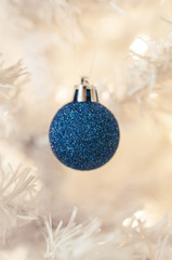 Blue Ball on white christmas tree, selective focus