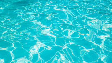 Fototapeta na wymiar Beautiful ripple wave and blue water surface in swimming pool, Blue water for background and abstract