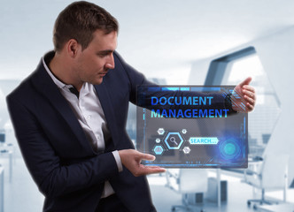 Business, Technology, Internet and network concept. Young businessman working on a virtual screen of the future and sees the inscription: Document management
