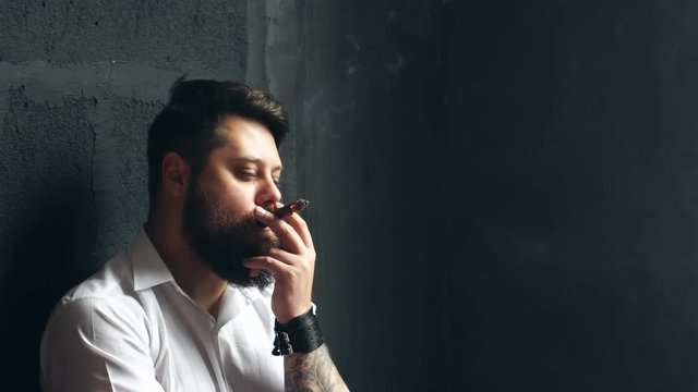 Brutal handsome man with ciga