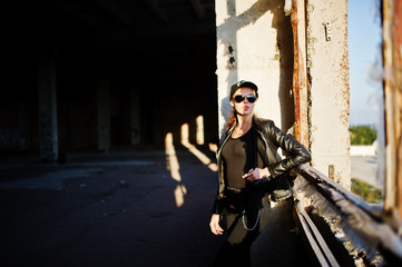 Fototapeta premium Sexy FBI female agent at abadoned place.