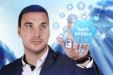 Business, Technology, Internet and network concept. Young businessman working on a virtual screen of the future and sees the inscription: Data breach