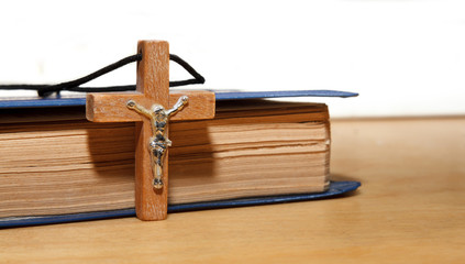 Book and a wooden cross