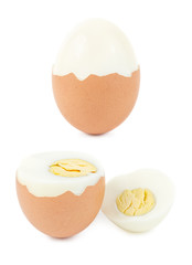 Half peeling of hard shell boiled egg isolated