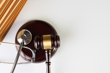 Law mallet or Judge gavel and medical stethoscope