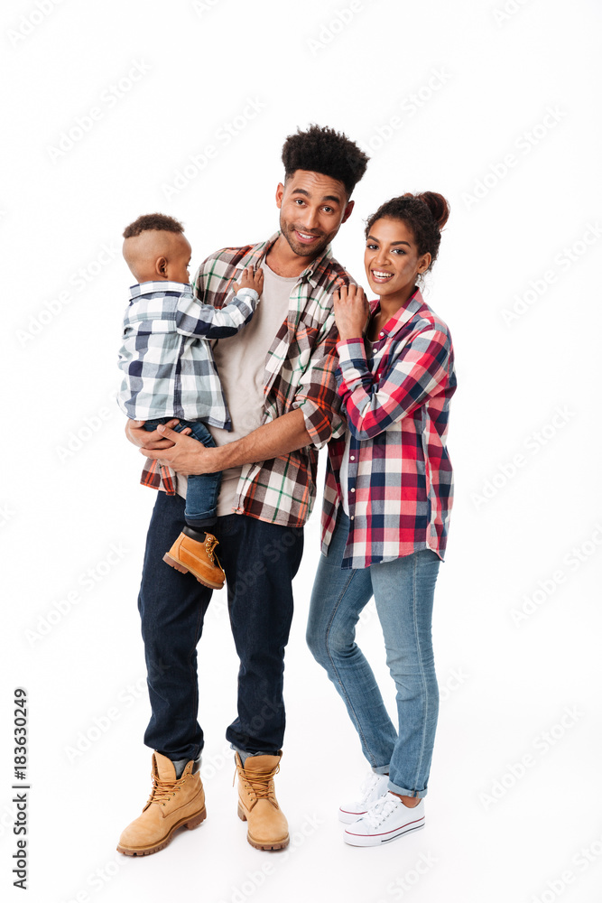 Wall mural full length portrait of a loving young african family