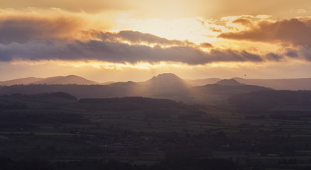 Torrential Sunset Clouds over Hilly Countryside in UK