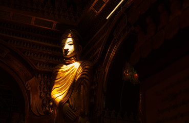 Fototapeta na wymiar a beam of light on the Buddha