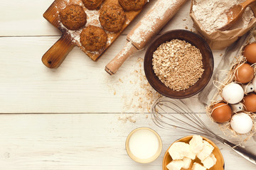 Oatmeal cookies and baking ingredients for homemade pastry background