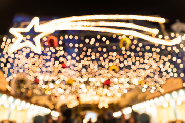 Blurred Christmas lights with shooting star at night