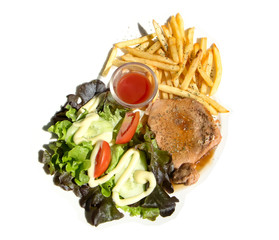 Pork steak in black pepper sauce with salad and  french frie