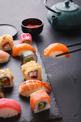 Eating sushi at restaurant, japanese cuisine