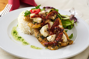 Grilled chicken with rice, feta cheese, dried plum and vegetables
