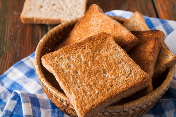 Breakfast background, toasts on checkered napkin closeup