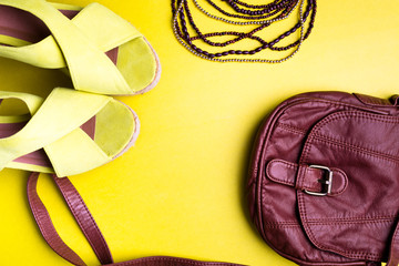 Set of Woman's Things Accessories to Summer Season. Brown Bag Yellow Platform Sandals, Necklace. Flat Lay.