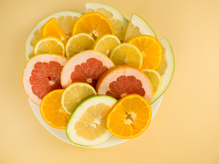 Colorful set of cut slices of citrus fruits of orange, lime, grapefruit, tangerine, lemon and pomelo. Mixed fresh health fruit. Background with citrus-fruit of lemon, orange and grapefruit slices.