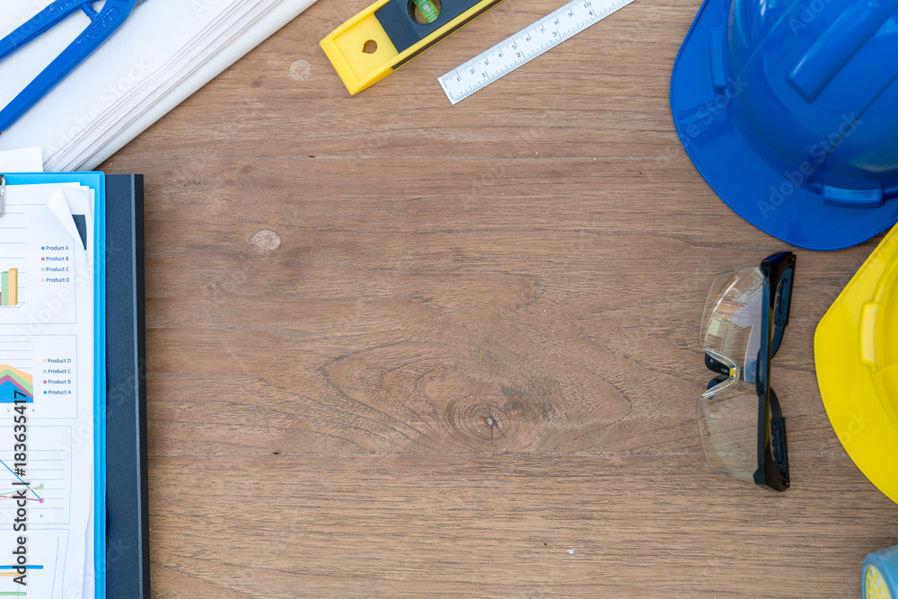 Poster architect engineer work table with safty helmet and drawing work tools on construction site