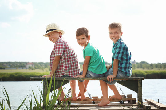 Cute children fishing on summer day